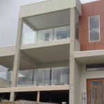 Front view on house with glass balustrades