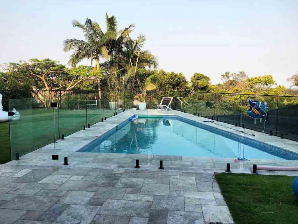 Modern Swimming Pool With Glass Pool Fencing