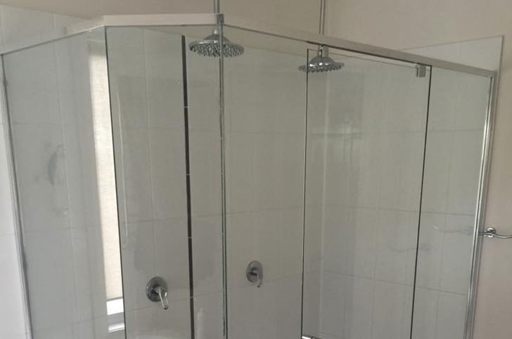 Double shower with glass shower door